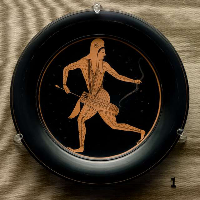 Attic red-figured Pinax. Diameter: 19.5 cm Height: 1.9 cm. Attributed to Epiktetos by signature. Made in Athens about 520-510 BC; from Vulci, Etruria. 